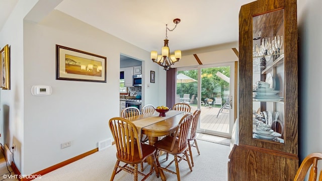 16101 Wabash Ave, South Holland, IL 60473 - carpeted dining room with a chandelier and baseboards