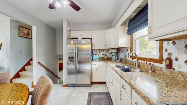 16101 Wabash Ave, South Holland, IL 60473 - kitchen featuring stainless steel fridge, a sink, a ceiling fan, decorative backsplash, and white cabinets