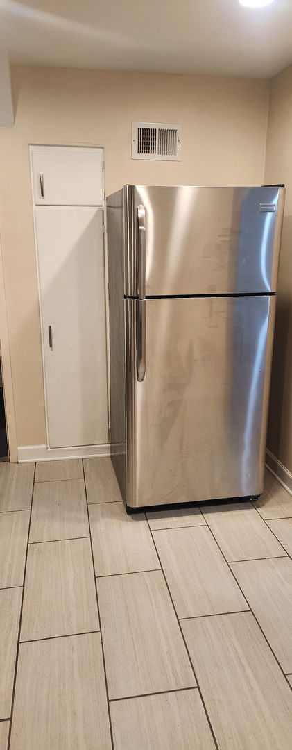3538 Western Ave Unit 0, Park Forest, IL 60466 - kitchen view of freestanding refrigerator and wood tiled floors