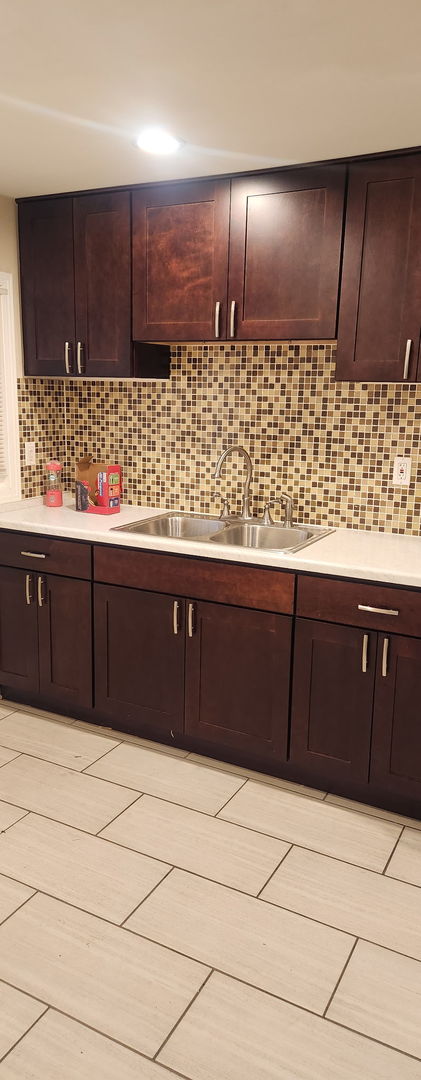 3538 Western Ave Unit 0, Park Forest, IL 60466 - kitchen with light countertops, tasteful backsplash, and dark brown cabinetry