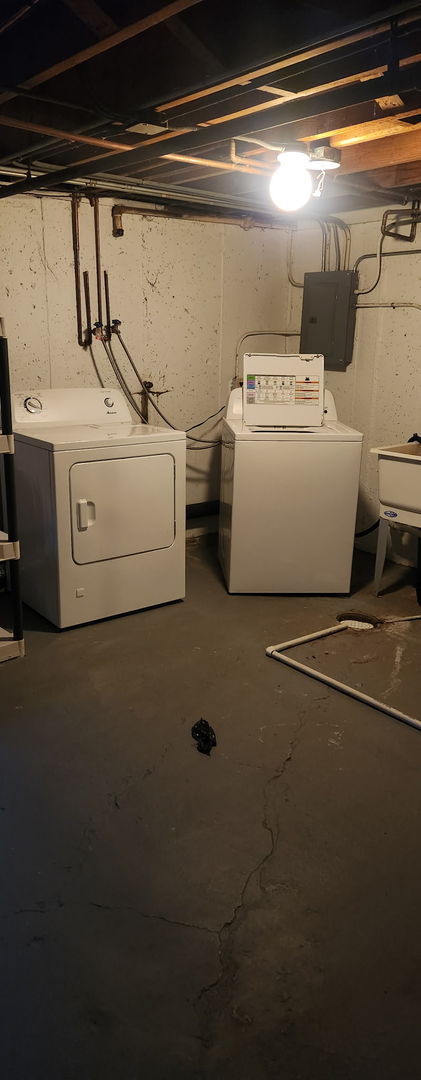 3538 Western Ave Unit 0, Park Forest, IL 60466 - unfinished below grade area featuring washer and clothes dryer and electric panel
