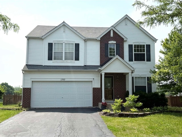 1707 Cascade Ridge Dr, Plainfield, IL 60586 - traditional-style house with brick siding, driveway, and an attached garage