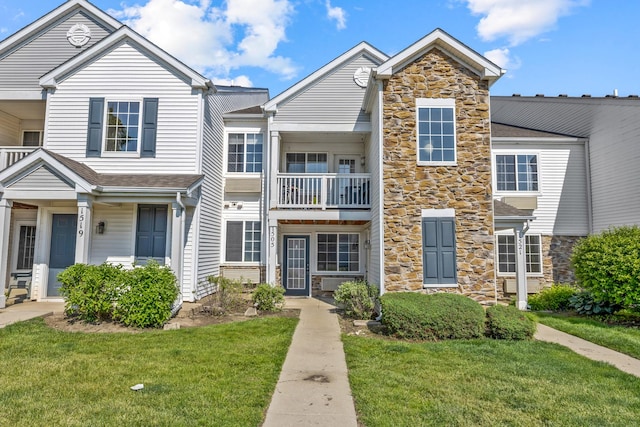 1505 Silverstone Dr Unit 1505, Carpentersville, IL 60110 - multi unit property featuring stone siding and a front yard