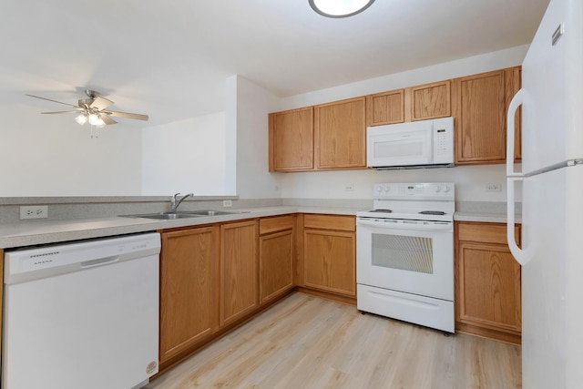 1505 Silverstone Dr Unit 1505, Carpentersville, IL 60110 - kitchen featuring white appliances, ceiling fan, light countertops, light wood-style floors, and a sink