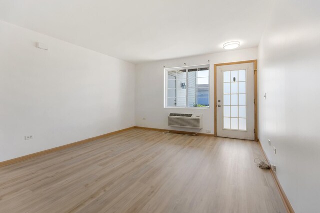 1505 Silverstone Dr Unit 1505, Carpentersville, IL 60110 - unfurnished room featuring light wood-type flooring, baseboards, and a wall mounted AC