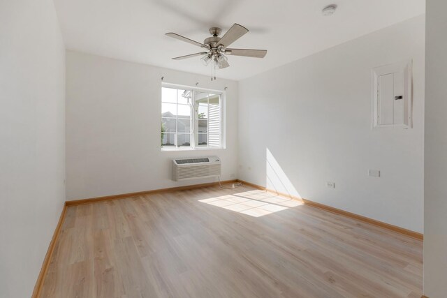 1505 Silverstone Dr Unit 1505, Carpentersville, IL 60110 - unfurnished room featuring electric panel, an AC wall unit, wood finished floors, a ceiling fan, and baseboards