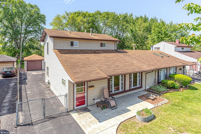 4037 W 90th Pl, Hometown, IL 60456 - back of house with a gate, a shingled roof, a detached garage, and an outbuilding