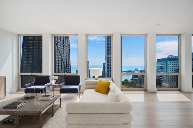 111 E Chestnut St Unit 40C, Chicago, IL 60611 - living area with a wall of windows, a water view, and wood finished floors