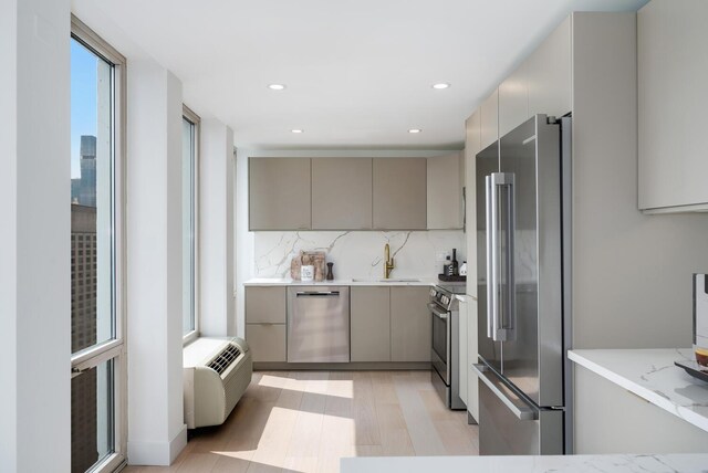 111 E Chestnut St Unit 40C, Chicago, IL 60611 - kitchen with appliances with stainless steel finishes, gray cabinetry, tasteful backsplash, modern cabinets, and recessed lighting