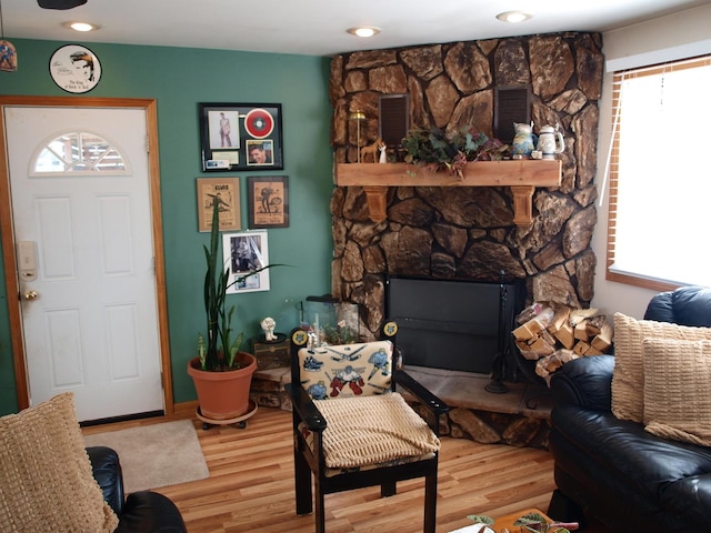 111 Magnolia Ln, Lindenhurst, IL 60046 - living room featuring plenty of natural light, wood finished floors, and a stone fireplace