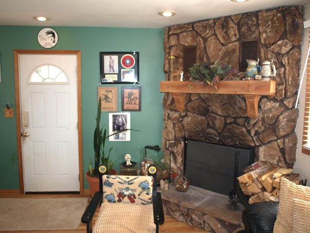 111 Magnolia Ln, Lindenhurst, IL 60046 - foyer with a stone fireplace and wood finished floors