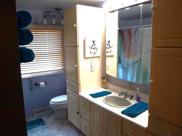 111 Magnolia Ln, Lindenhurst, IL 60046 - bathroom featuring tile patterned flooring, vanity, and toilet