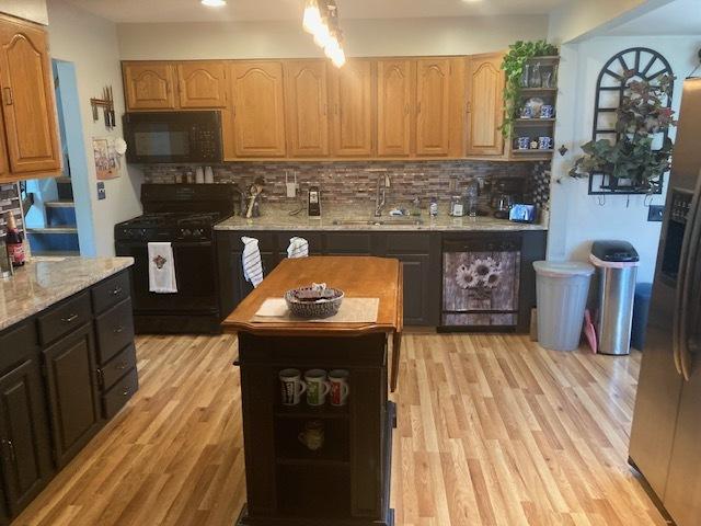 111 Magnolia Ln, Lindenhurst, IL 60046 - kitchen with black appliances, open shelves, a sink, decorative backsplash, and recessed lighting