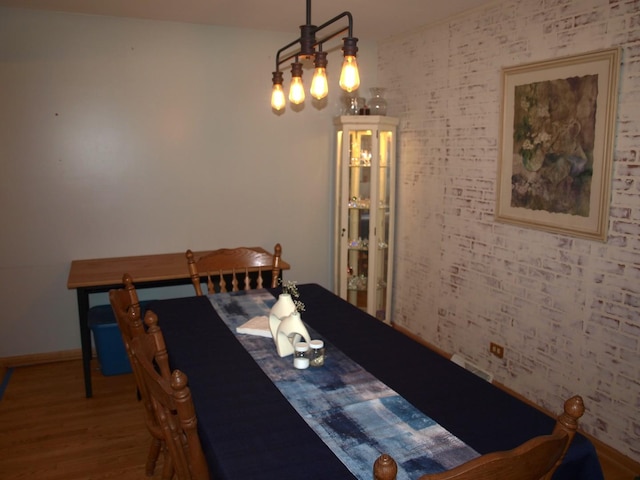 111 Magnolia Ln, Lindenhurst, IL 60046 - dining room with wood finished floors, a chandelier, and baseboards