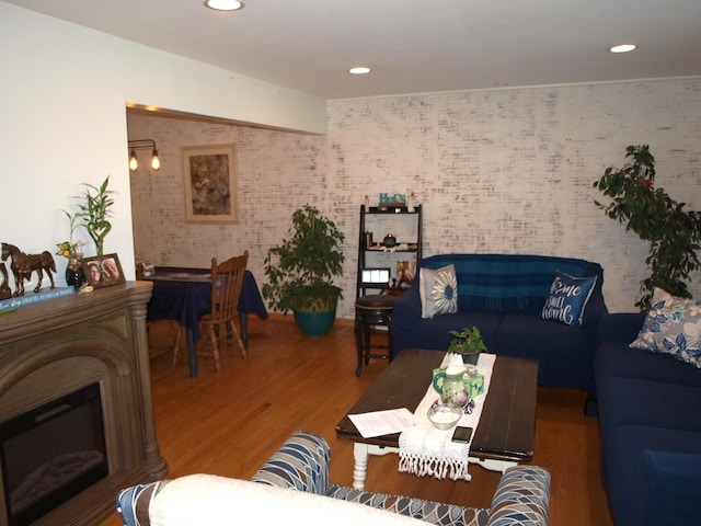 111 Magnolia Ln, Lindenhurst, IL 60046 - living room featuring wood finished floors, brick wall, and recessed lighting