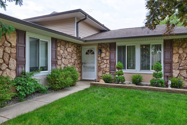 833 Summerfield Dr, Roselle, IL 60172 - view of exterior entry featuring stone siding and a yard