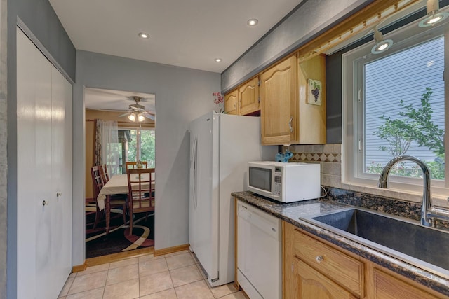 833 Summerfield Dr, Roselle, IL 60172 - kitchen featuring white appliances, a sink, backsplash, dark countertops, and a ceiling fan