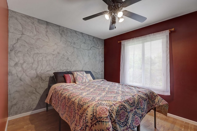 833 Summerfield Dr, Roselle, IL 60172 - bedroom with an accent wall, baseboards, wood finished floors, and ceiling fan