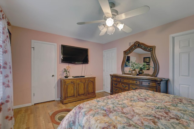 833 Summerfield Dr, Roselle, IL 60172 - bedroom with light wood finished floors, baseboards, and ceiling fan
