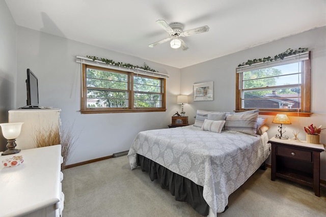 931 Sunset Rd, Wheaton, IL 60189 - bedroom with light colored carpet, baseboards, and a ceiling fan