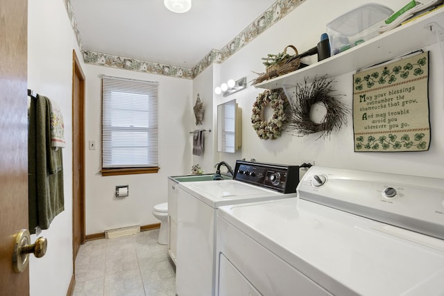 931 Sunset Rd, Wheaton, IL 60189 - laundry area with separate washer and dryer, a baseboard heating unit, light tile patterned flooring, and baseboards