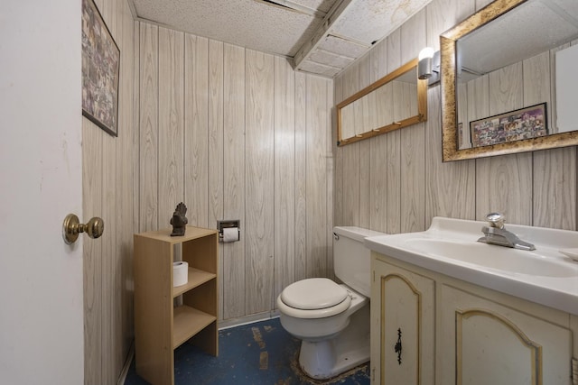 931 Sunset Rd, Wheaton, IL 60189 - bathroom featuring wooden walls, vanity, toilet, and concrete floors