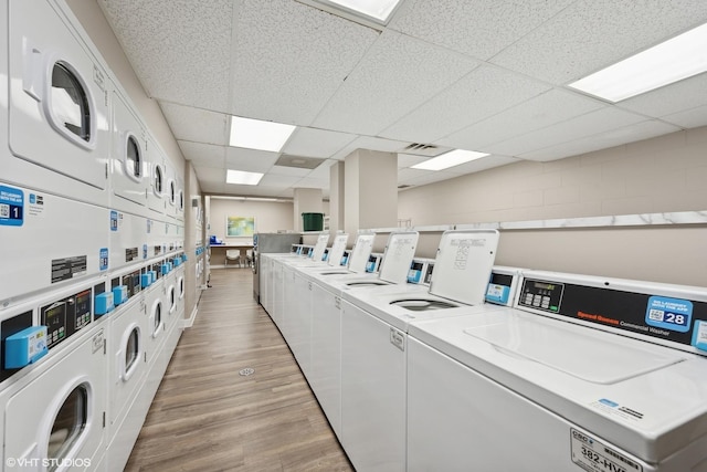 1636 N Wells St Unit 615, Chicago, IL 60614 - community laundry featuring estacked washer and dryer, washer and clothes dryer, and light wood-type flooring