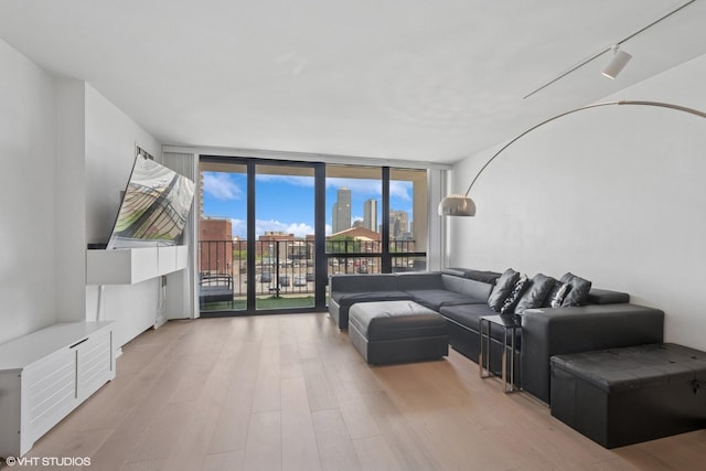 1636 N Wells St Unit 615, Chicago, IL 60614 - living area featuring expansive windows and light wood finished floors