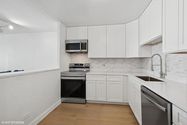 1636 N Wells St Unit 615, Chicago, IL 60614 - kitchen with appliances with stainless steel finishes, a sink, and white cabinets