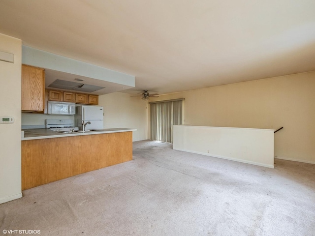 1292 Inverrary Ln Unit 7D, Palatine, IL 60074 - kitchen featuring white appliances, a peninsula, open floor plan, light colored carpet, and brown cabinets