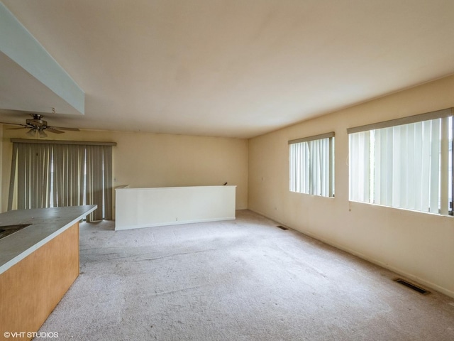 1292 Inverrary Ln Unit 7D, Palatine, IL 60074 - spare room with light colored carpet and ceiling fan