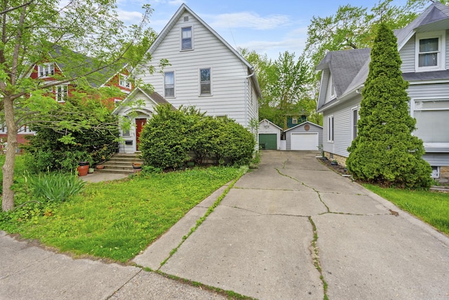 623 Dekalb Ave, Dekalb, IL 60115 - view of front of house with a garage and an outbuilding