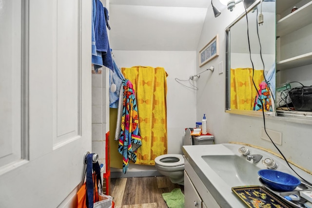 623 Dekalb Ave, Dekalb, IL 60115 - full bath featuring vanity, wood finished floors, toilet, a shower with curtain, and vaulted ceiling