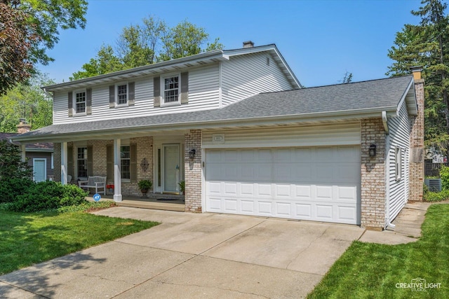 1903 Brentwood Ln, Wheaton, IL 60189 - traditional-style home featuring a chimney, brick siding, and an attached garage