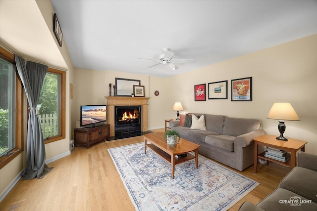 1903 Brentwood Ln, Wheaton, IL 60189 - living room featuring a ceiling fan, a lit fireplace, and light wood-type flooring
