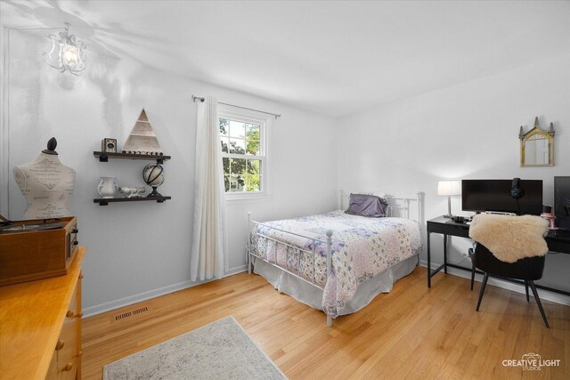 1903 Brentwood Ln, Wheaton, IL 60189 - bedroom with wood finished floors and baseboards