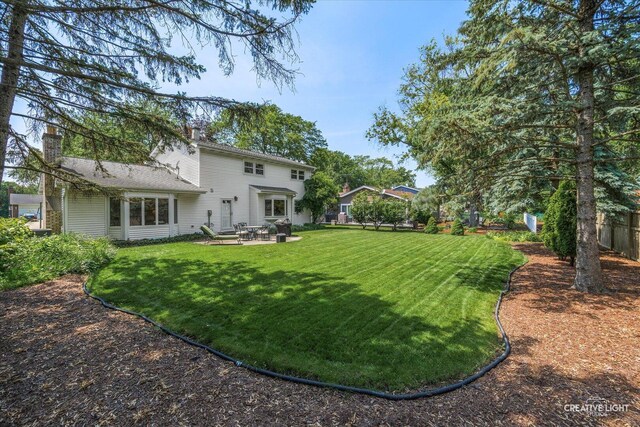 1903 Brentwood Ln, Wheaton, IL 60189 - back of house with a patio and a chimney