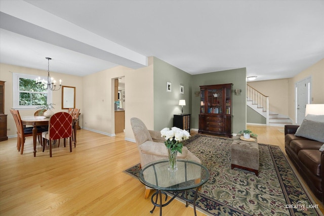 1903 Brentwood Ln, Wheaton, IL 60189 - living area with light wood-type flooring, a chandelier, and stairway