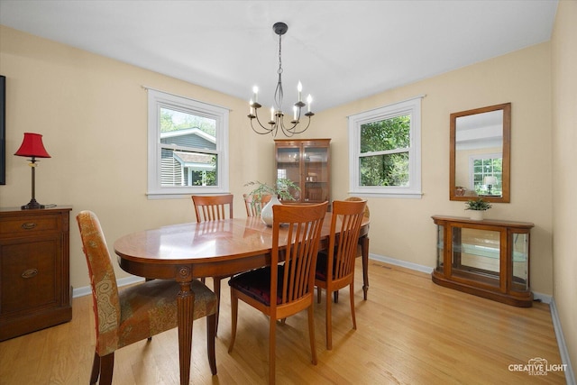 1903 Brentwood Ln, Wheaton, IL 60189 - dining room with a chandelier, plenty of natural light, and light wood finished floors