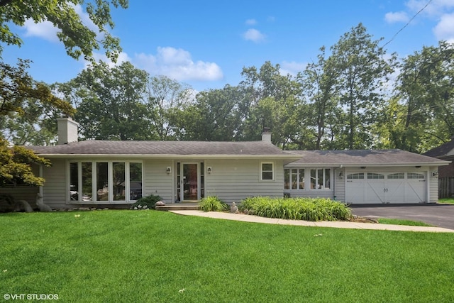 359 N Shady Ln, Elmhurst, IL 60126 - view of front of property with a front lawn, a chimney, asphalt driveway, and an attached garage