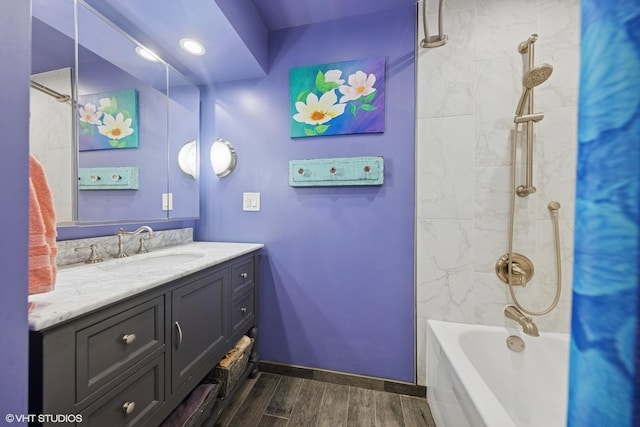 359 N Shady Ln, Elmhurst, IL 60126 - bathroom featuring wood finished floors, vanity, baseboards, and bathing tub / shower combination