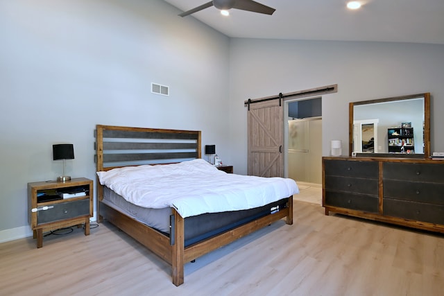 1422 Deer Creek Ln, Lake In The Hills, IL 60156 - bedroom featuring wood finished floors, a barn door, high vaulted ceiling, baseboards, and ceiling fan