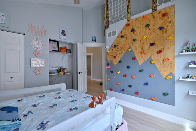 1422 Deer Creek Ln, Lake In The Hills, IL 60156 - bedroom with wood finished floors, a closet, and a towering ceiling