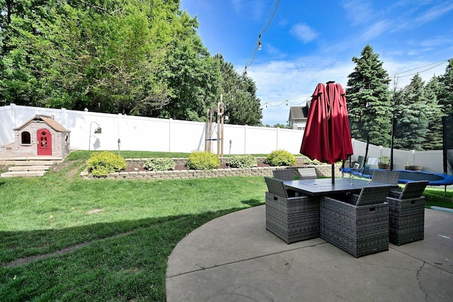 1422 Deer Creek Ln, Lake In The Hills, IL 60156 - view of patio / terrace with a trampoline and outdoor dining area