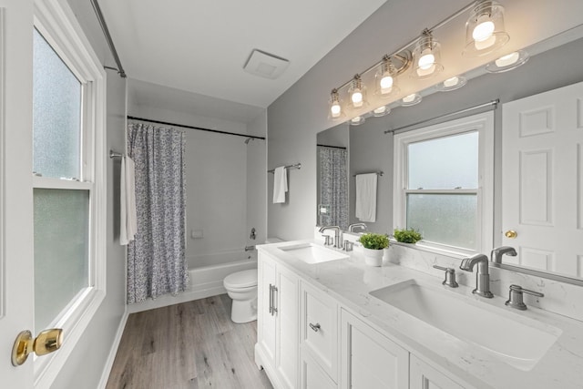 926 Navajo St, Carol Stream, IL 60188 - bathroom featuring double vanity, shower / bathtub combination with curtain, and wood finished floors