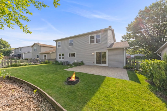 926 Navajo St, Carol Stream, IL 60188 - back of property featuring a patio area, a fire pit, a fenced backyard, and a chimney