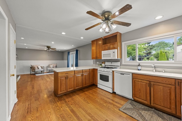 926 Navajo St, Carol Stream, IL 60188 - kitchen with white appliances, a ceiling fan, a peninsula, light countertops, and recessed lighting