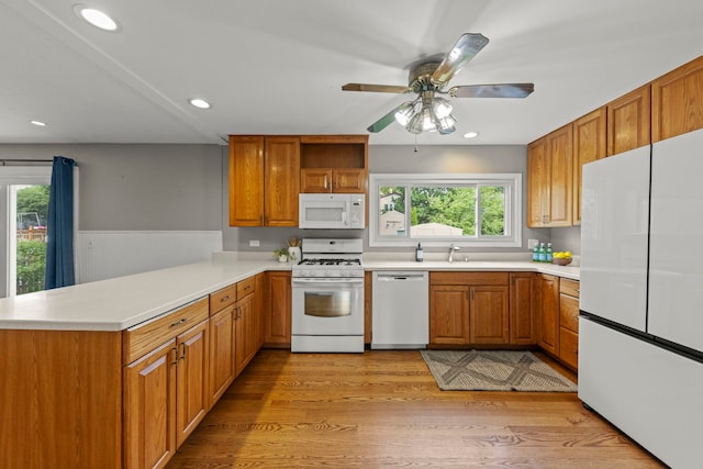 926 Navajo St, Carol Stream, IL 60188 - kitchen featuring white appliances, a peninsula, light countertops, and recessed lighting