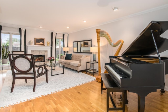 1023 Rene Ct, Park Ridge, IL 60068 - living room with crown molding, light wood-type flooring, a tile fireplace, and recessed lighting