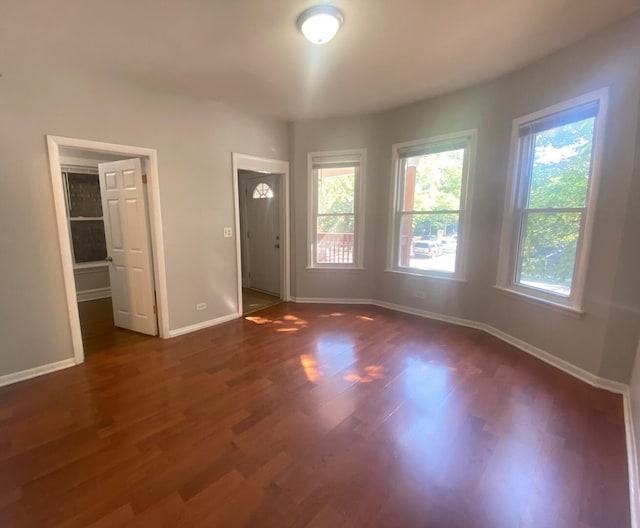 4224 N Kimball Ave, Chicago, IL 60618 - unfurnished room with dark wood-type flooring and baseboards